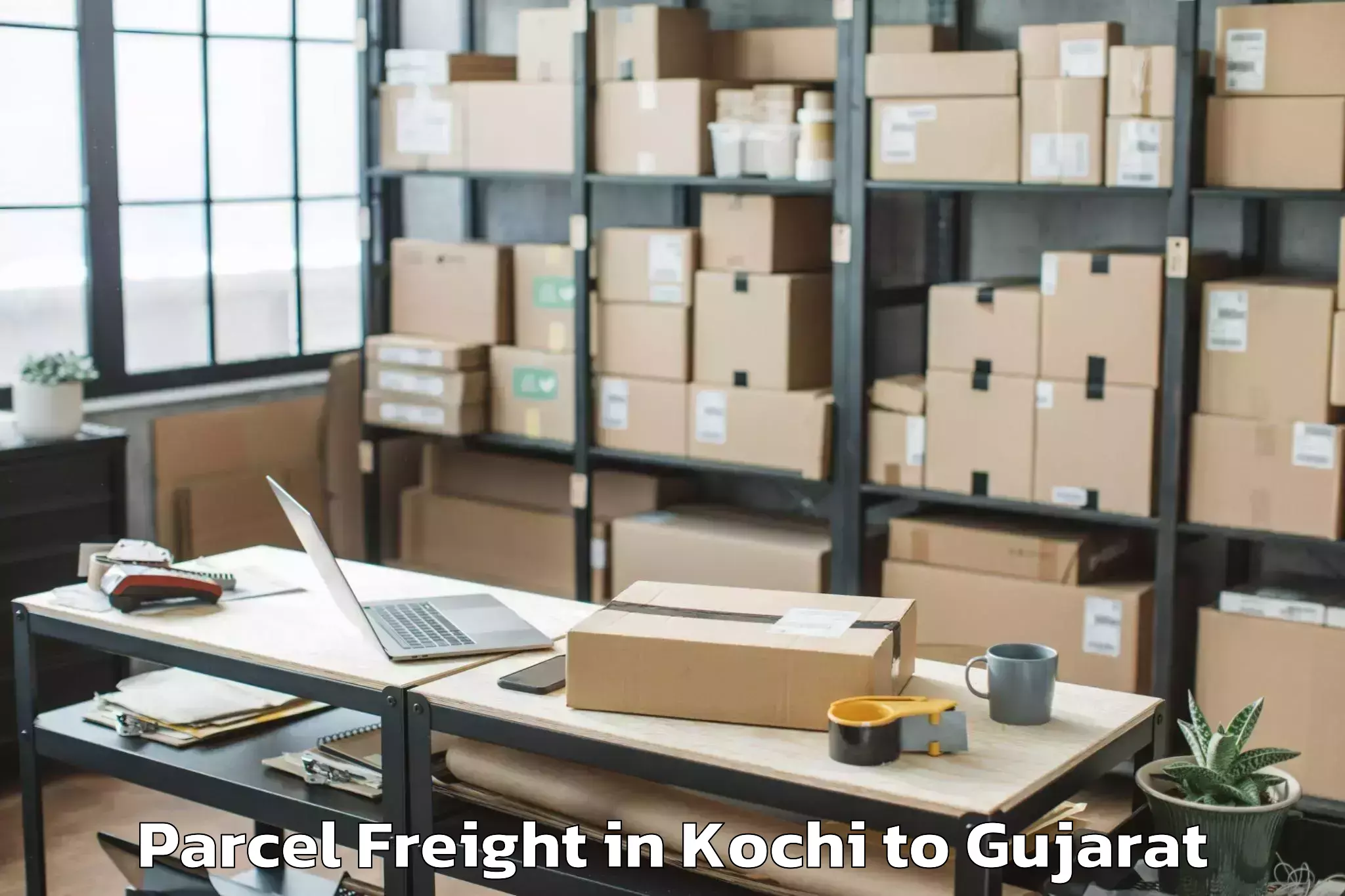 Book Kochi to Uka Tarsadia University Bardol Parcel Freight